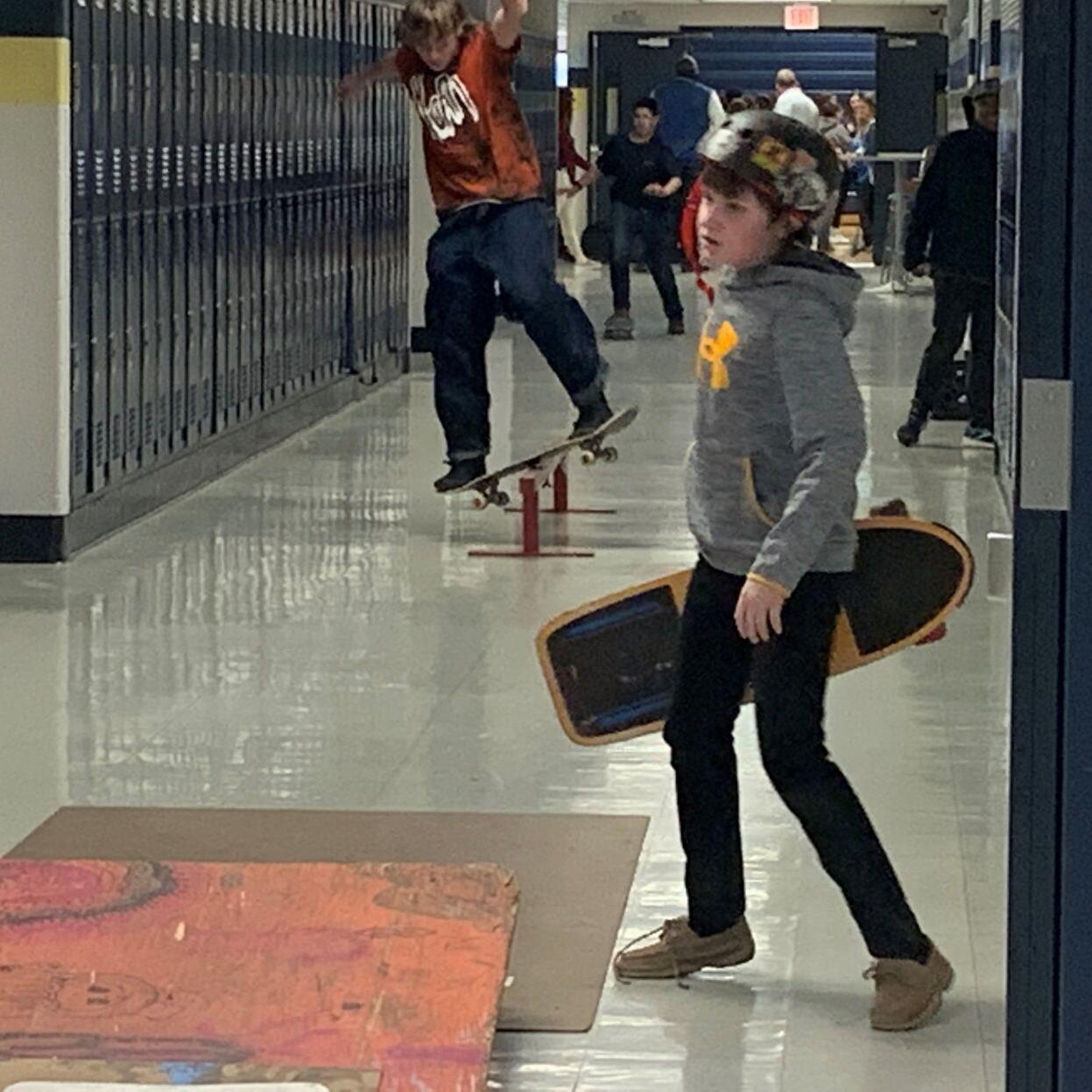 Skateboarding inside East Middle 3